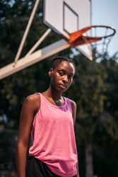 Confident female basketball player on the court