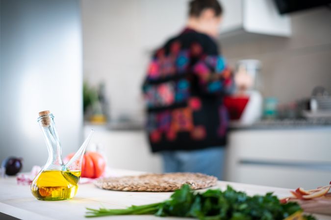 Crop woman preparing vegetable salad