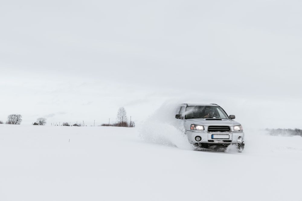 Car driving on snow field
