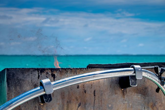 A BBQ flame starting on the ocean