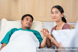 Woman visiting male family member while he’s recovering in hospital 5ozWm0