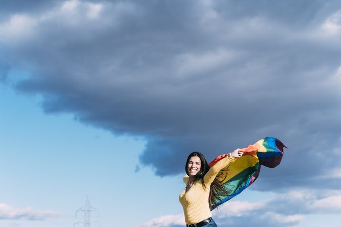 Young woman with gay flag