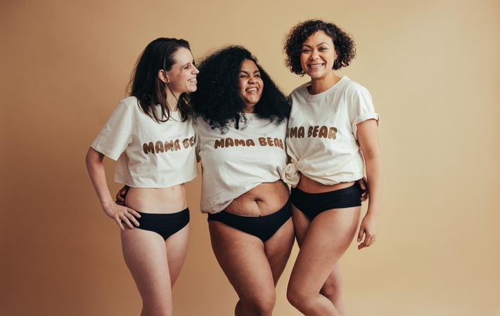 Body positive women embracing their post pregnancy bodies