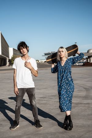 Couple standing near modern building