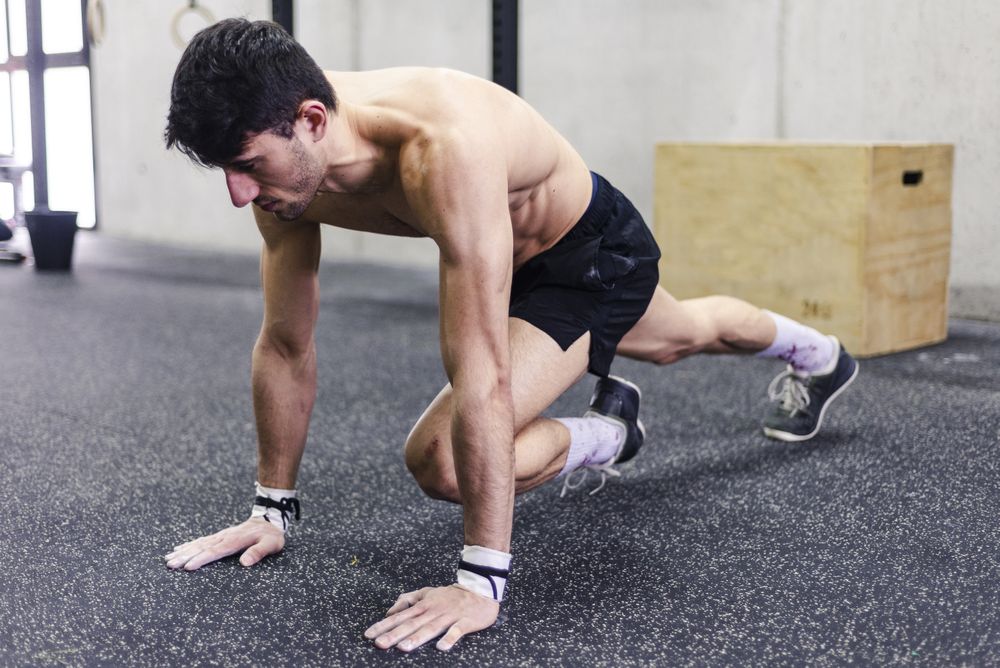 Man stretching in gym