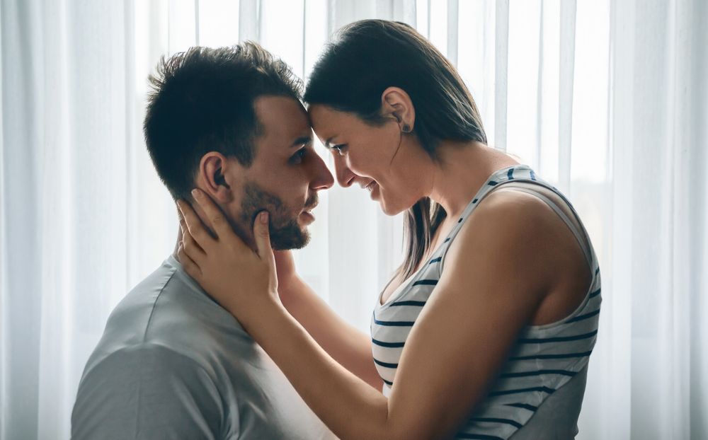 Embracing couple looking into eyes