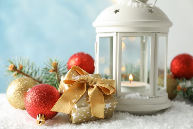 Christmas lantern on decorated background, space for text