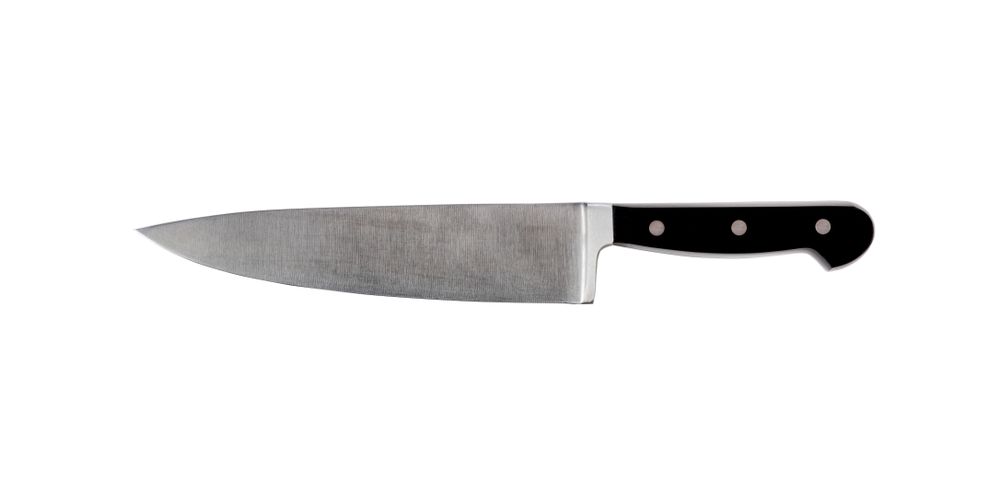 Large steel kitchen knife isolated on plain background