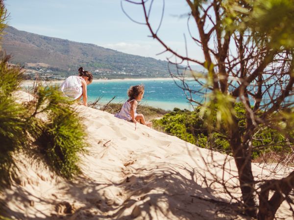 small girls having a stroll at beach