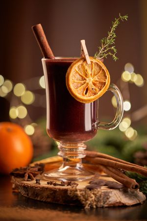 Mulled wine on table with coniferous branches