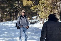 Man waiting male in winter forest