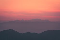 Sunset sky over mountain ridge
