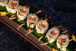 Delicious fried sushi with cream on tray