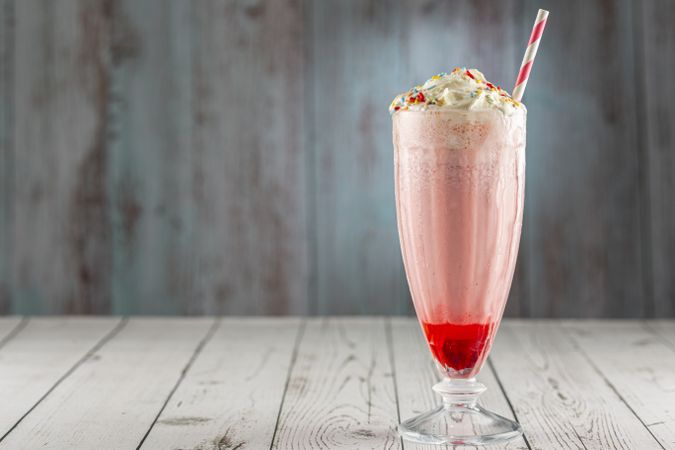Strawberry milkshake with whipped cream.