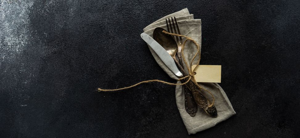 Top view of napkin with decorative cotton and feathers with space for text