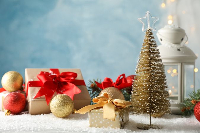 Christmas lantern and tree on decorated background, space for text