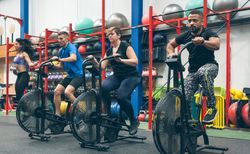 Athletes doing air bike indoor