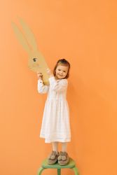 Little girl with paper bunny