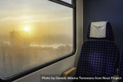 Train interior with sunrise view on window 5kGo35