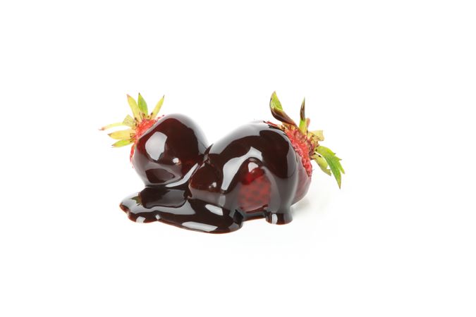 Chocolate fondue. Strawberry in chocolate sauce isolated on blank background