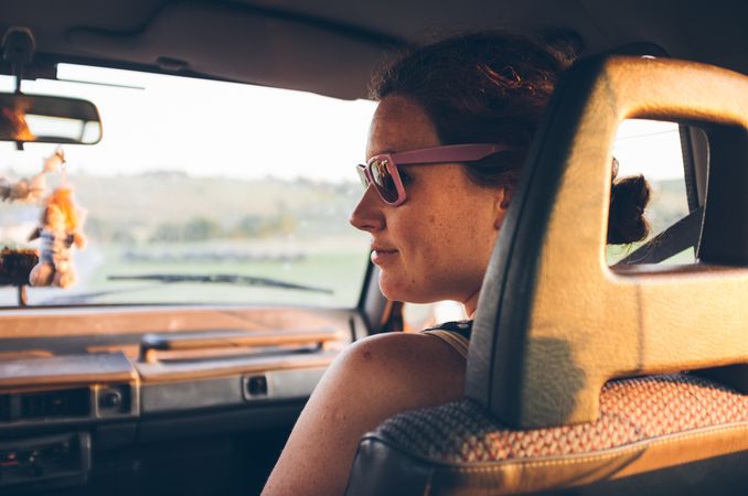 Young woman traveling in car