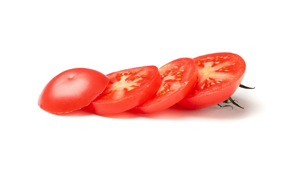 Slices of tasty tomato isolated on neutral background