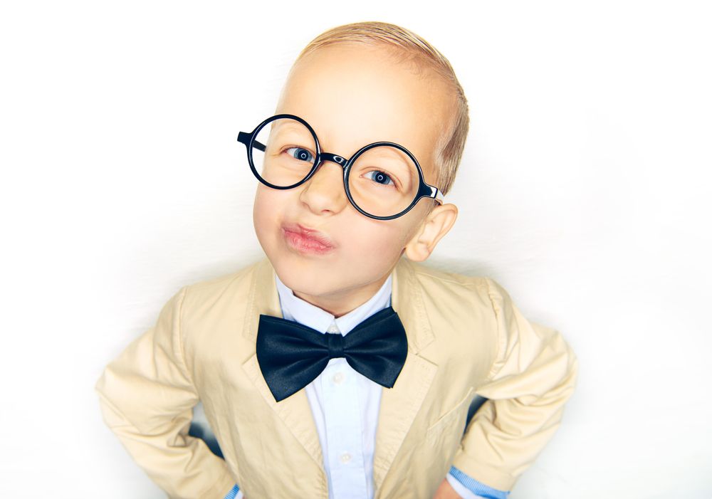 Cute blond boy in glasses