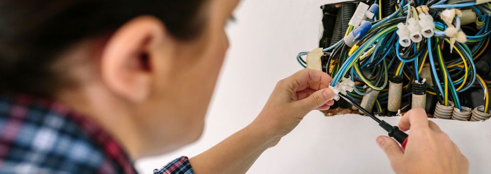 Electrician working on the electrical installation of a house