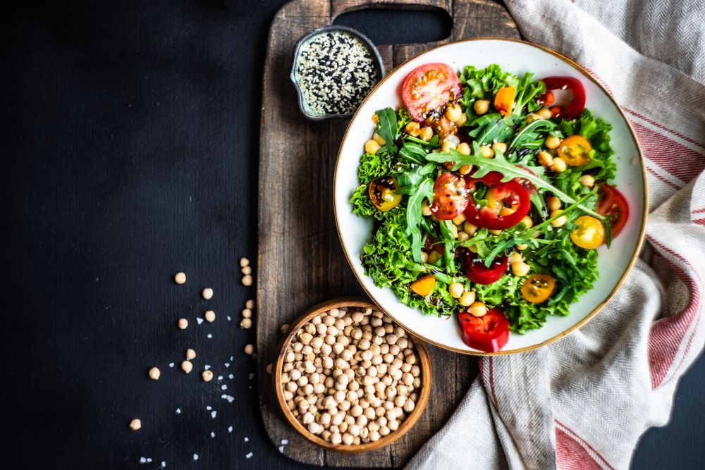 Top view of bowl of vegetable salad with garbanzo beans