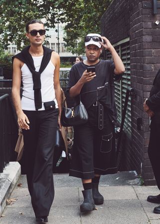 London, England, United Kingdom - September 18 2021: Two fashionable men emerging from the subway
