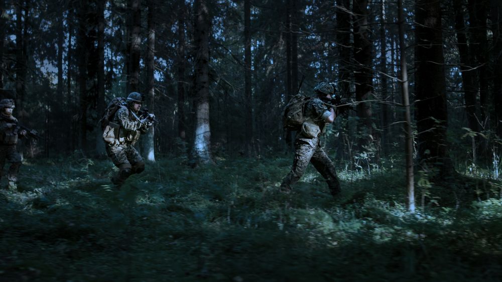 Fully Equipped Soldiers Wearing Camouflage Uniform Attacking Enemy, Rifles in Firing Position.