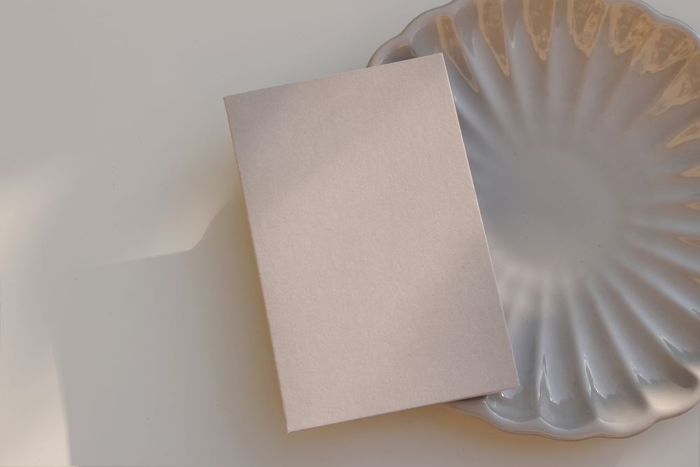 Mock up invitation on plate with shadows