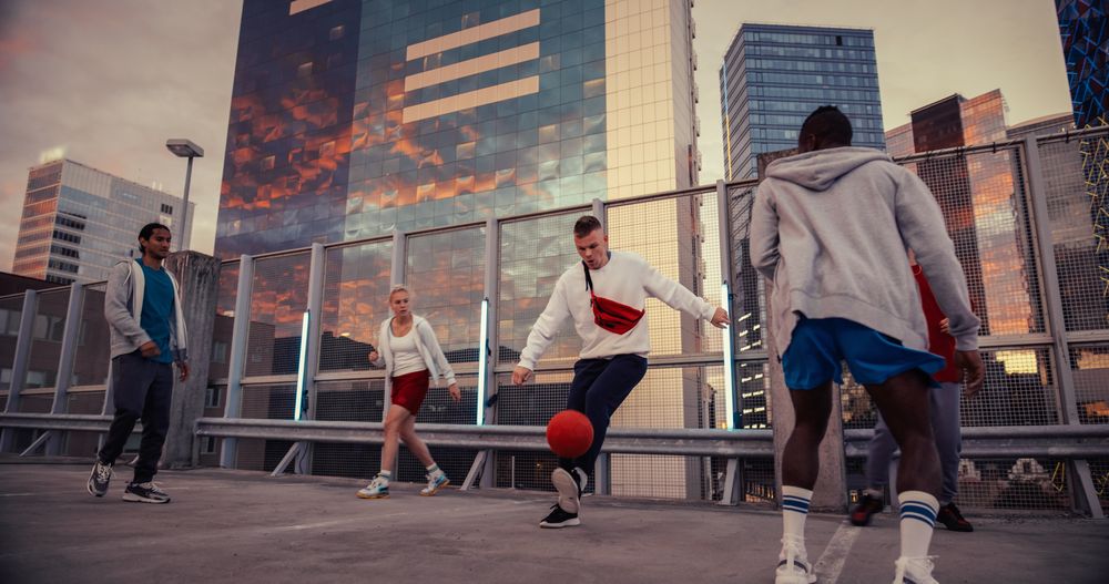 Young Man Playing Soccer with Diverse Friends.
