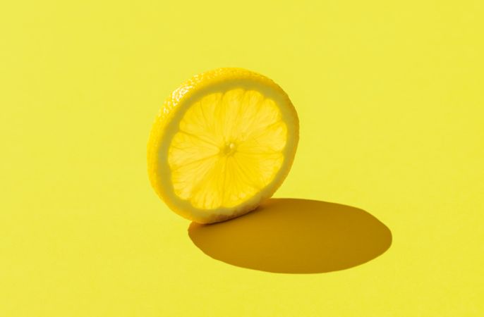 Lemon slice minimalist on a yellow background