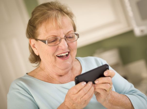 Older Adult Woman Texting on Smart Cell Phone