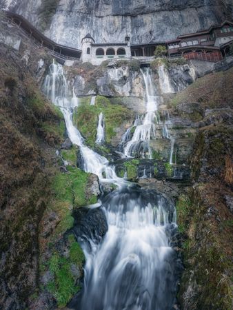 Picturesque waterfall on high cliff