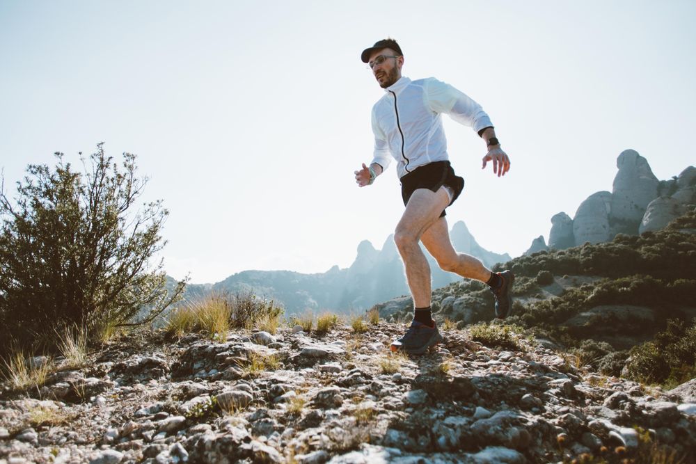 Man training on rugged terrain