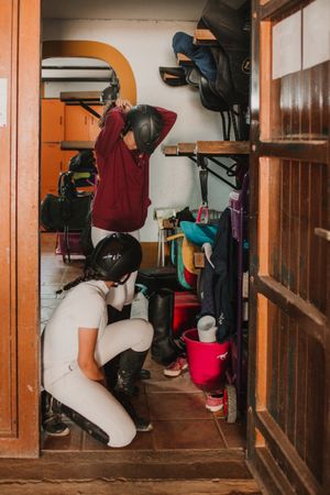 Women preparing for horse riding
