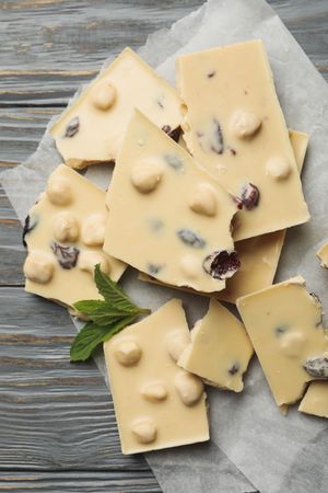 Baking paper with light chocolate and mint on gray wooden table