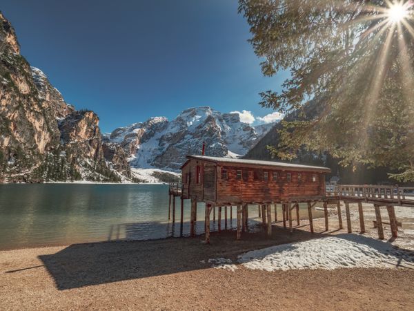 Wooden house on stilts on serene lake
