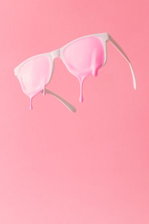 Pink paint dripping out of lenses of sunglasses