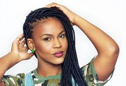 Portrait of confident woman with her hands to her hair