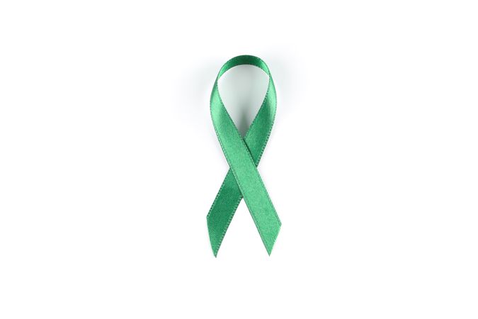 Green awareness ribbon isolated on blank background