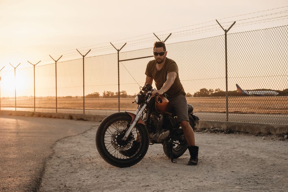 Strong man driving motorcycle
