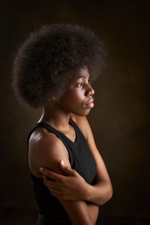 Woman with afro hairstyle seen from the side