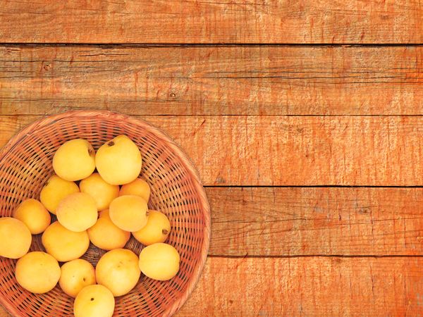 Apricots On The Wooden Background