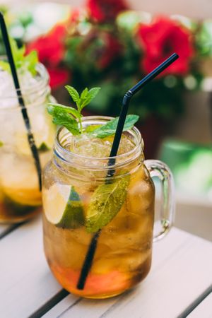 Mojito in mason jar on wooden table