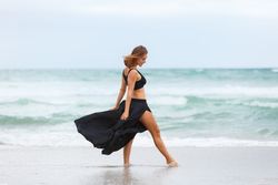 woman dancing near sea