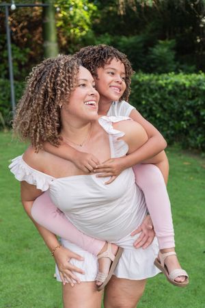 Mother having fun with her daughter at park