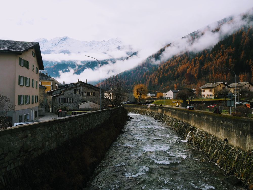 Autumn Frost: Frozen River in Poschiavo's Enchanting Village